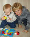 Wes and Jared, playing with the Elmo puzzle.JPG (127058 bytes)